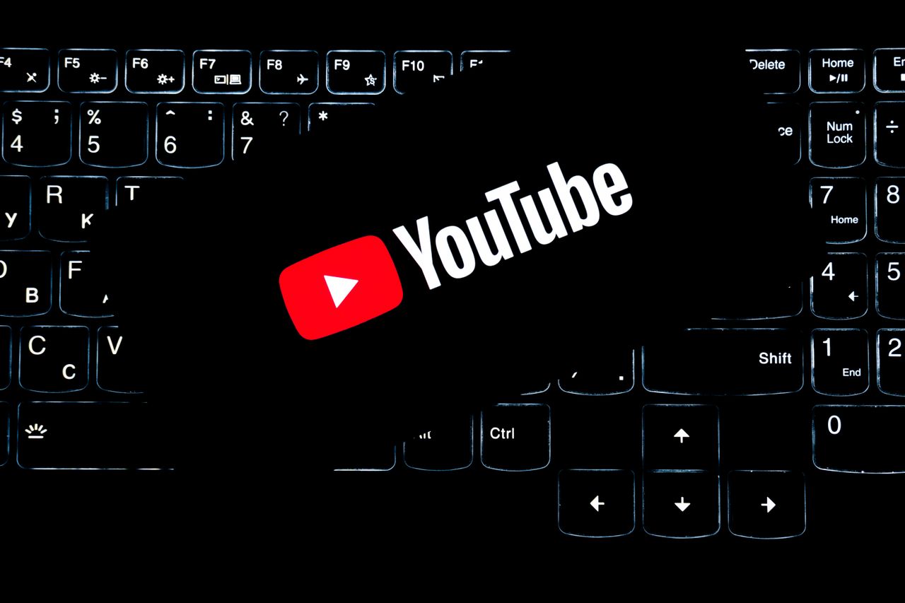 hero-img YouTube logo displayed on a backlit keyboard, representing digital media and online content creation.